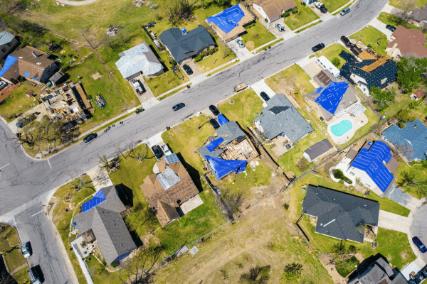 Aerial view of damaged homes in a neighborhood